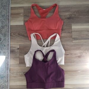 Fabletics Sports Bras in Coral, Beige, and Plum